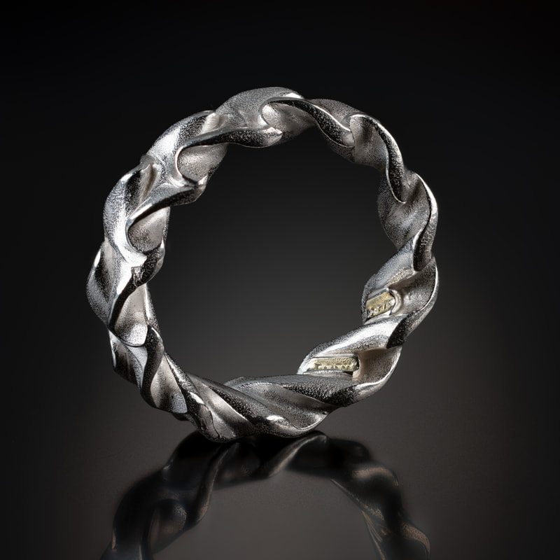 Innovation Award: Nick Grant Barnes, Silver Spring, MD, U.S.  “Ring 5” (8.5 x 7 x 2.5 mm) Argentium silver, photo by David Terao, www.foldforming.org