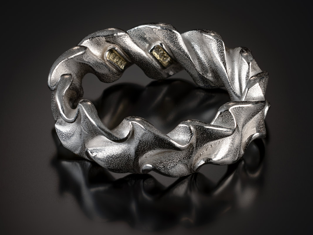 Innovation Award: Nick Grant Barnes, Silver Spring, MD, U.S.  “Ring 5” (8.5 x 7 x 2.5 mm) Argentium silver, photo by David Terao, www.foldforming.org