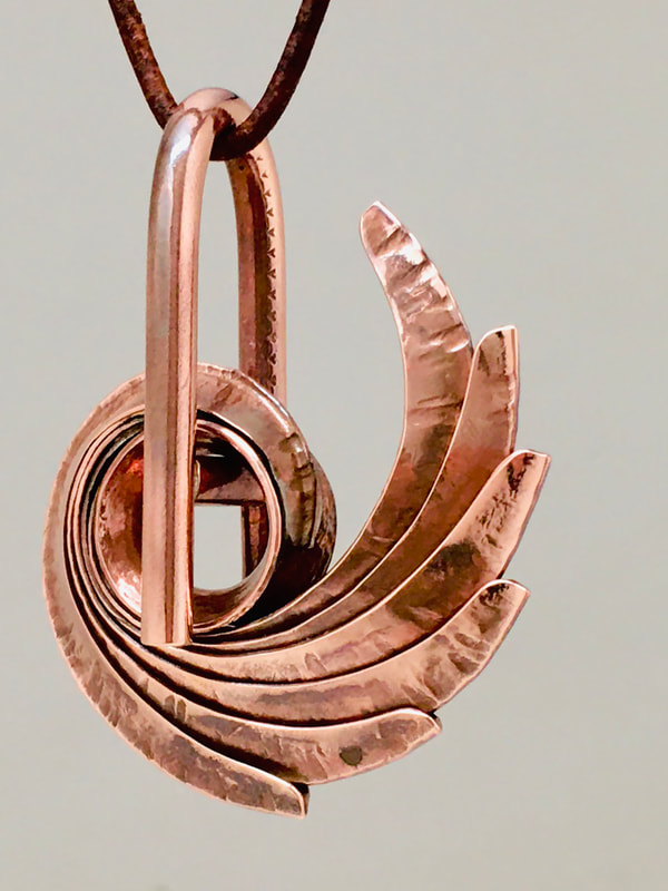 THIRD PLACE: Thomas Filippini, Richmond, VA, U.S. “Balance Knot” (2 x 2 in) Copper, photos by Silvio Dominic, www.foldforming.org