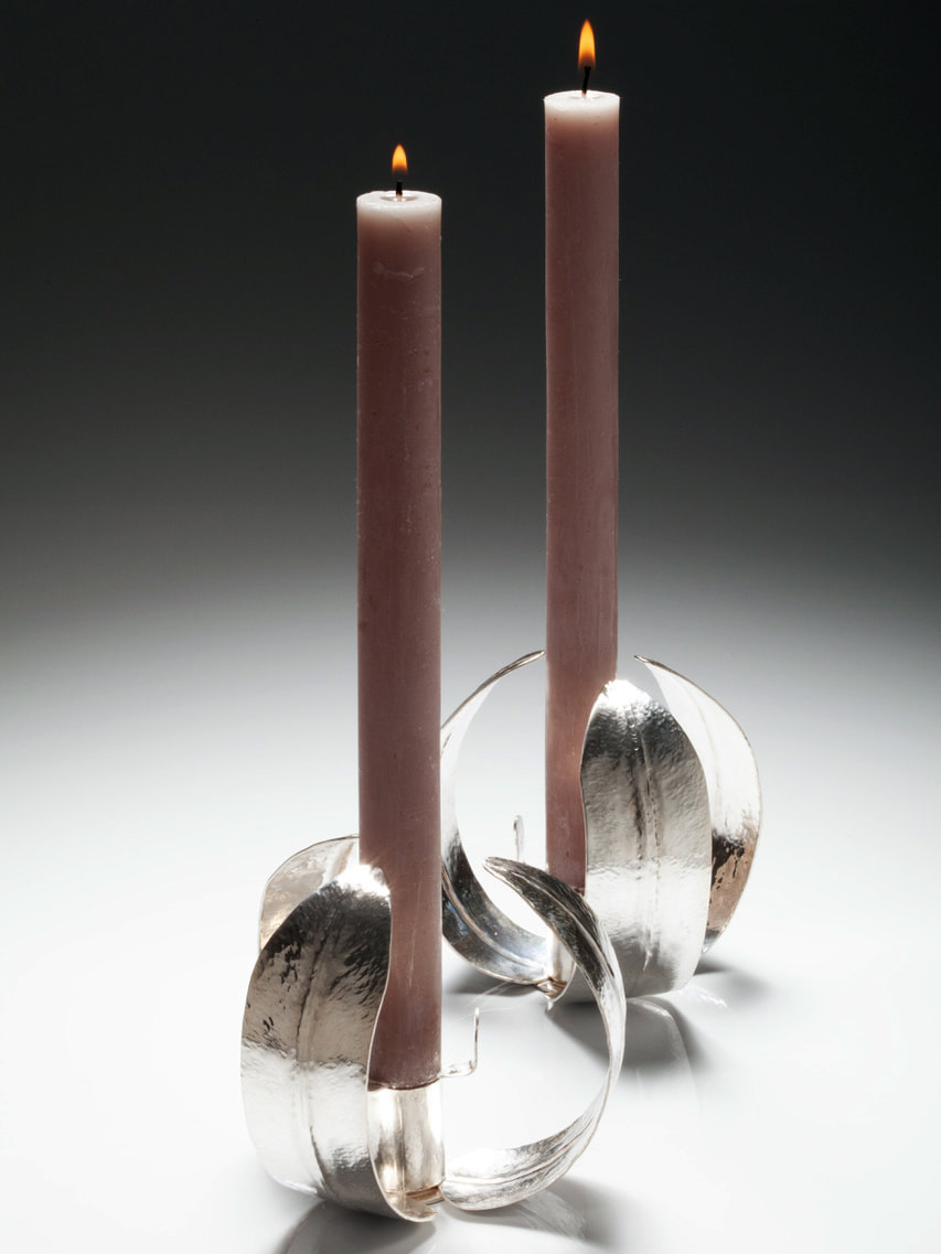 Karen Lockton, Silverstone, England, U.K. “Pair of Feather Foldformed Multiway Candlesticks” (9.5 x 10 cm). 935 Argentium silver; photo by Simon Martin Photography - www.foldforming.org