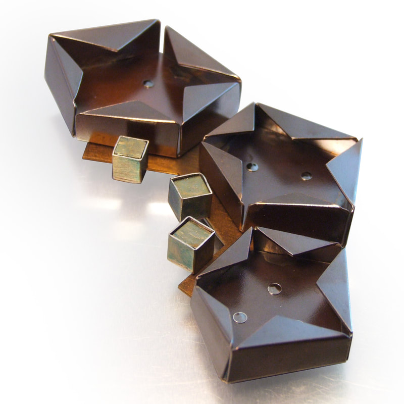 Melody Armstrong, Regina, Saskatchewan, Canada “Star Pin Iron Pyrite” (9.4 x 5.2 x .1.2 cm) Copper, sterling silver, titanium, iron pyrite - www.foldforming.org
