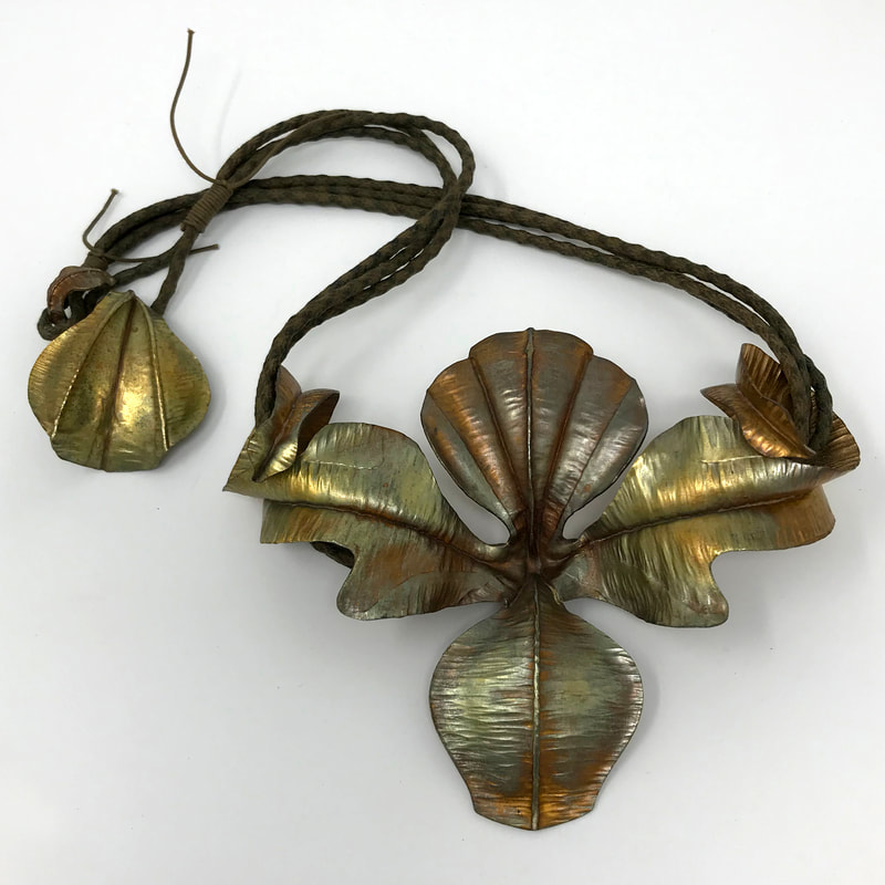 Mary K. McIntyre, Toronto, Ontario, Canada. “Small Georgia Neckpiece” (14 x 11 x 3 cm) Bronze, Japanese cotton cord, www.foldforming.org
