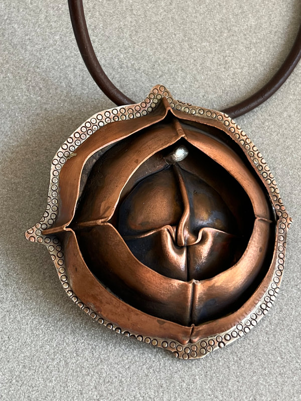 Kathryn Nelson, Falls Church, VA, U.S. 	“Folded Rose” Copper, sterling silver (6 x 6 x 1 cm), www.foldforming.org