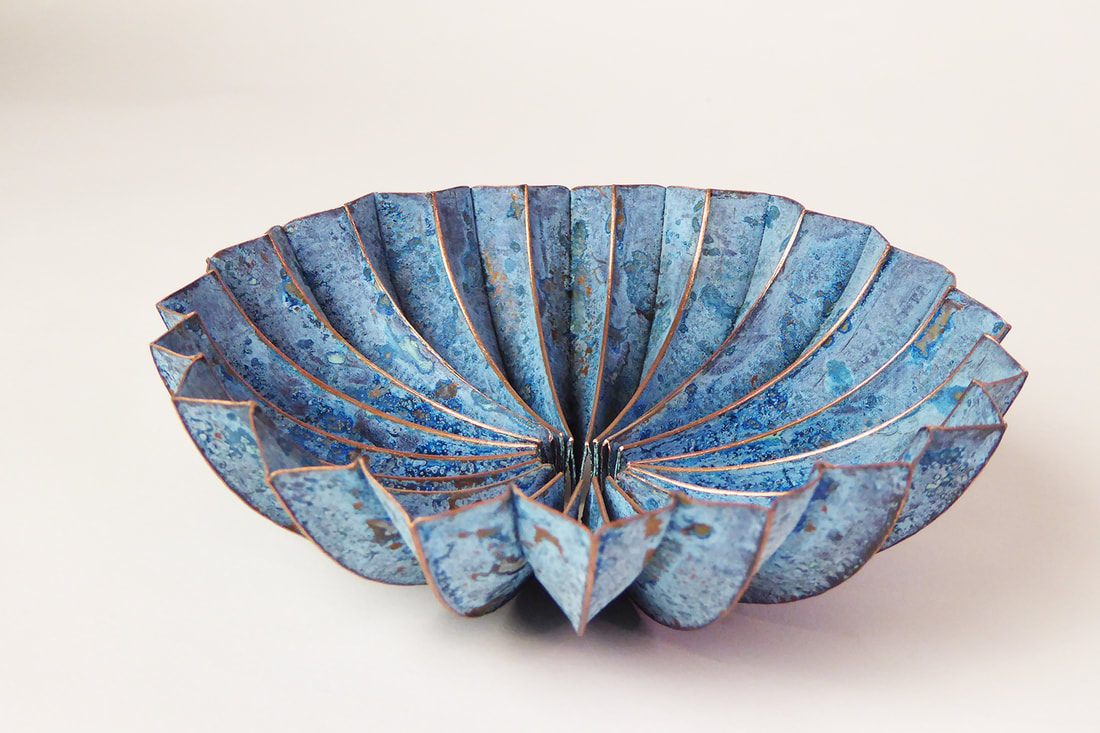 SECOND PLACE: Emma-Jane Rule, Leicester, England, U.K. “Blue Pod Dish” (15 x 15 x 5 cm) Copper, ammonia, salt, www.foldforming.org