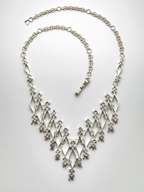 Sher Novak, Oakland, CA, U.S. “Alhambra Necklace” (38 x 14.6 x .47 cm) Sterling silver; photo by George Post - www.foldforming.org